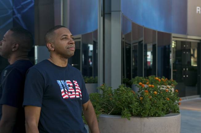 Marcus Mitchell, a local Las Vegas gambler who donates a majority of his winnings to those in need, stands on a pedestrian bridge between Aria and The Cosmopolitan, Tuesday Aug. 13, 2013. Since the passing of his wife in 2008, Marcus has been finding ways to randomly help people he comes in contact with, either in person or online.